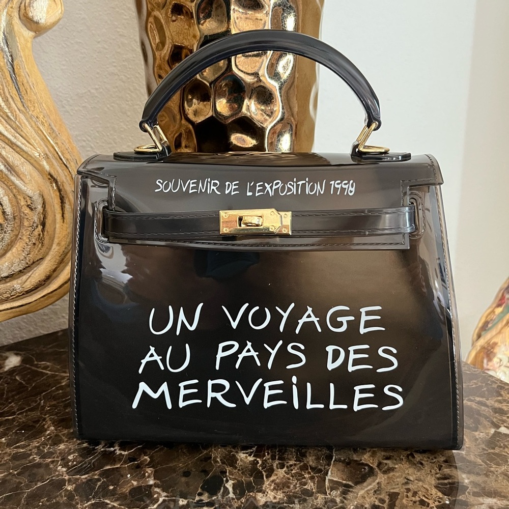 Souvenir De L’Exposition 1998 Un Voyage Au Pays Des Merveilles Handbag. Black